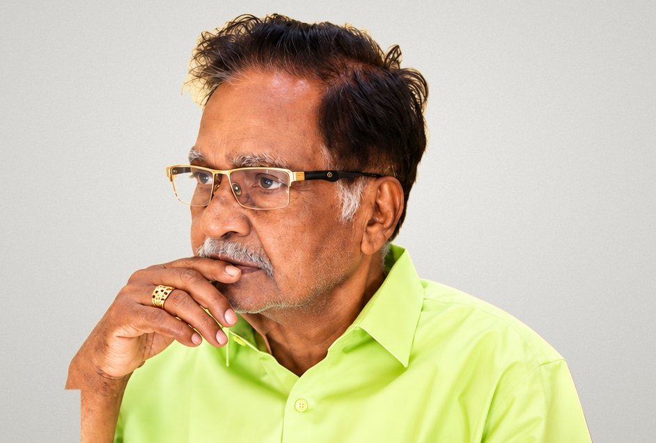 Dr. M. Christopher, determined, deep in thought