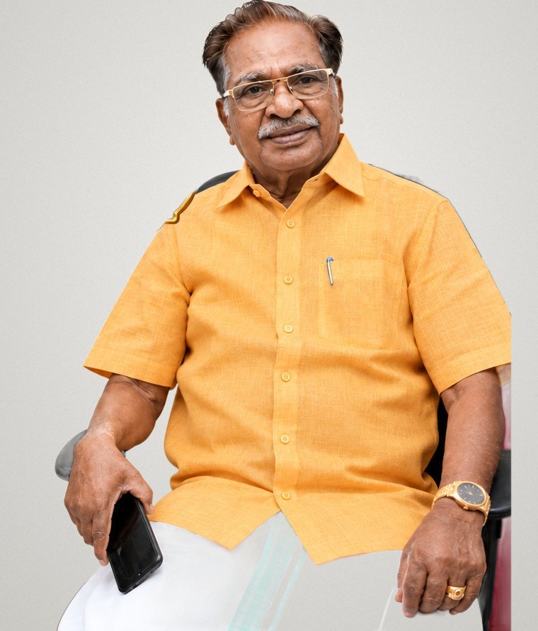 Dr. M. Christopher in a mustard shirt